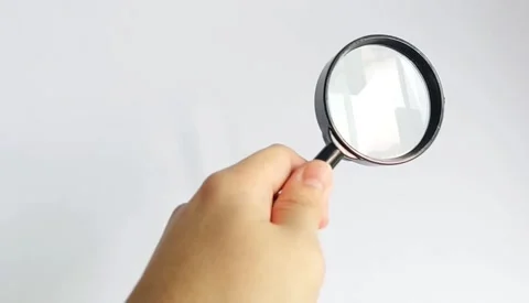 Hand Holding Magnifying Glass Stock Footage 339079558