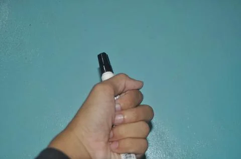 The hand holding the marker to write Stock Photos