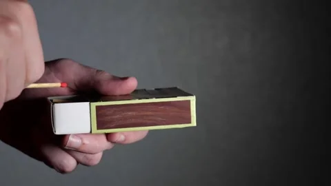 Hand holding a match in slow motion Video stock 244008071