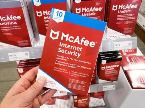A hand holding McAfee Internet Security box Stock Photos