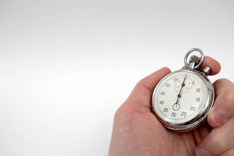 Hand holding a mechanical stopwatch timer Stock Photos