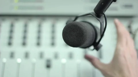 Hand holding microphone Stock Footage 70783355