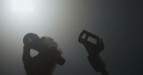 Hand holding a microphone Stock Footage 103660778