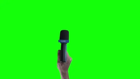 Hand holding microphone for interview or press conference on green screen Stock Footage 313188357