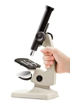 Hand holding microscope Stock Photos