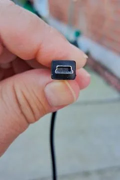 Hand Holding Mini USB Cable Connector Stock Photos