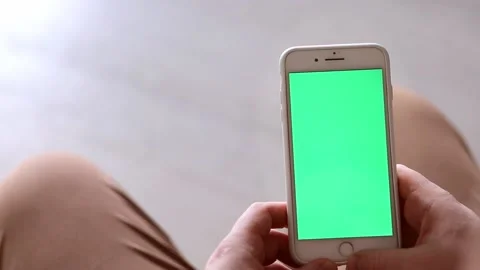 Hand holding mobile phone, soft focus Stock Footage 221242302