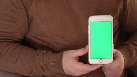 Hand holding mobile phone, soft focus Stock Footage 221242309