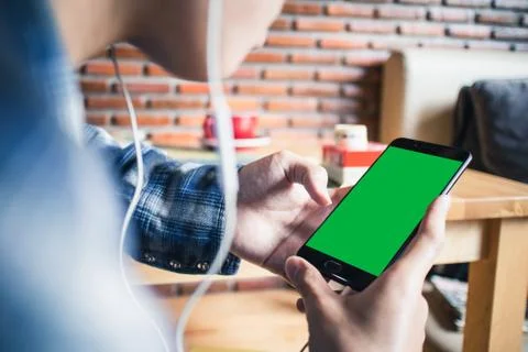 Hand holding Mock-up green screen smart phone Stock Photos