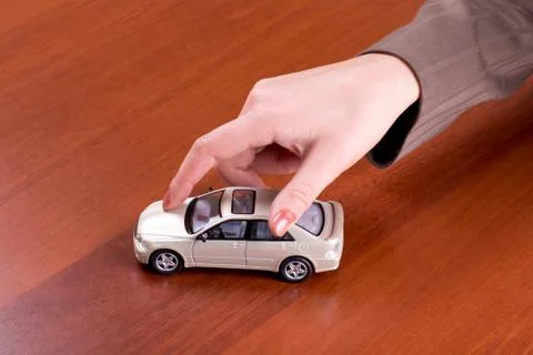 Hand holding the model of car Stock Photos
