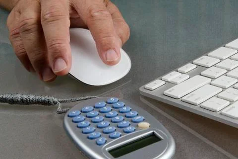Hand holding mouse Foto stock