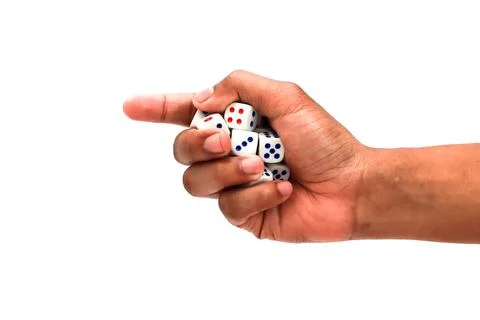 Hand Holding Multiple White Dice With Red and Blue Dots Against A White Bac.. Stock Photos