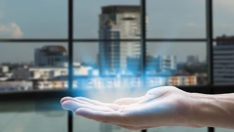 Hand holding network using 5G technology with virtual screen icons on the city b Stock Footage 124847315