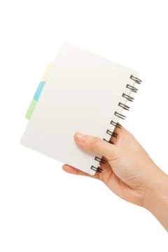 Hand holding a notebook Stock Photos