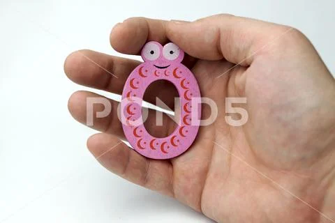 Hand holding number zero. Stock Photos