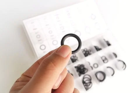A hand holding an O-ring Stock Photos