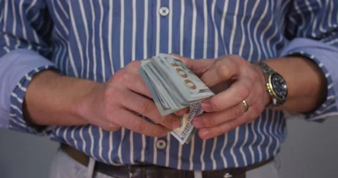 A hand holding an object in his hand Stock Footage 155534660