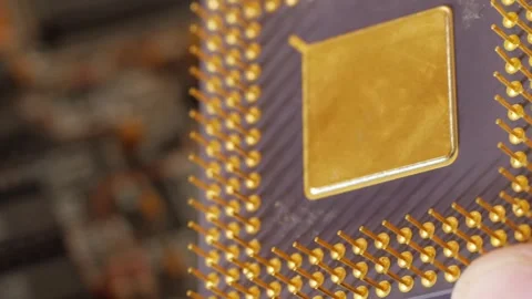 Hand holding an old generation computer microprocessor Stock Footage 279539222