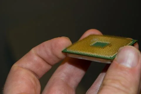 Hand holding an old processor Stock Photos