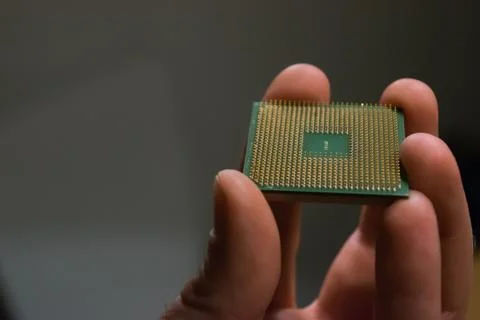 Hand holding an old processor Stock Photos