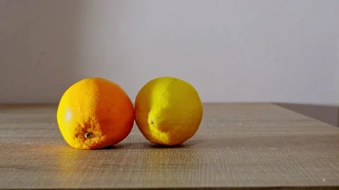Hand holding orange Stock Footage 233077269