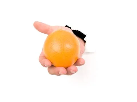Hand holding an orange Foto stock