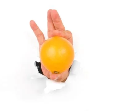 Hand holding an orange Stock Photos
