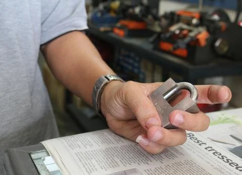 Hand Holding a Padlock Stock Photos
