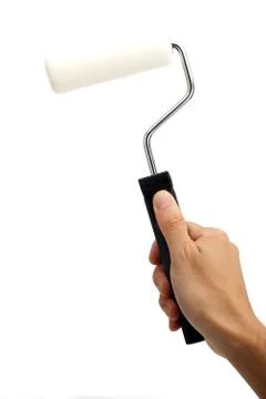 Hand holding paint roller Stock Photos