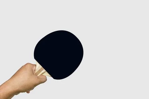 Hand holding Pair of black  ping-pong rackets , isolated on white background Stock Photos