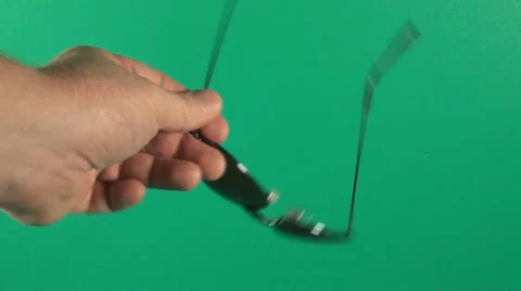 Hand Holding A Pair Of Glasses In Front Of Green Screen Stockbeeldmateriaal 29155673
