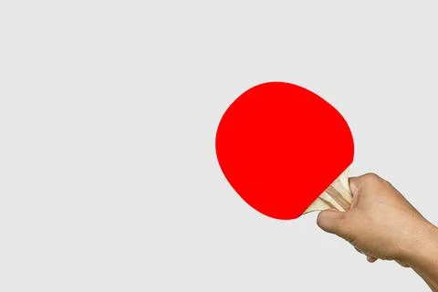 Hand holding Pair of red ping-pong rackets , isolated on white background Stock Photos