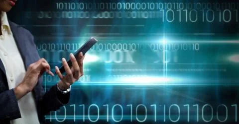 Hand holding phone with binary code technology background Stock Photos