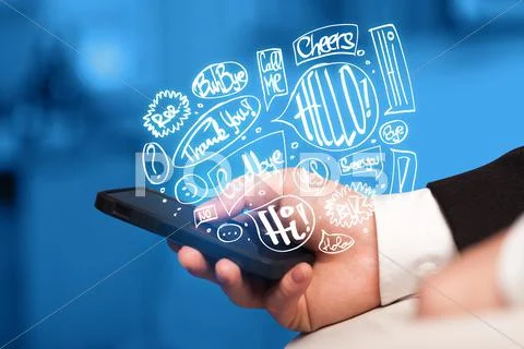 Hand holding phone with hand drawn speech bubbles Stock Photos