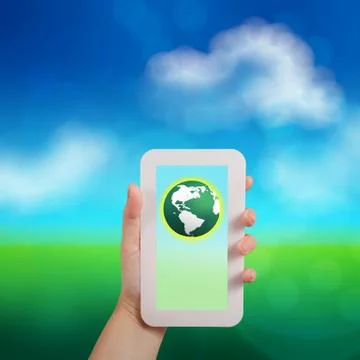 Hand holding the phone tablet touch computer gadget with green globe as conce Ilustração Stock