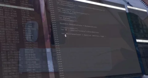 Hand holding phone tapping screen, monitor showing IDE, cursor moving, code Stock Footage 328396648