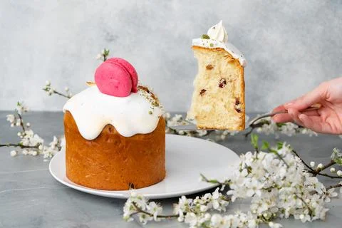 Hand holding piece of Easter cake on dessert spatula Stock Photos
