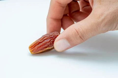 Hand holding  pitted dates Stock-Fotos
