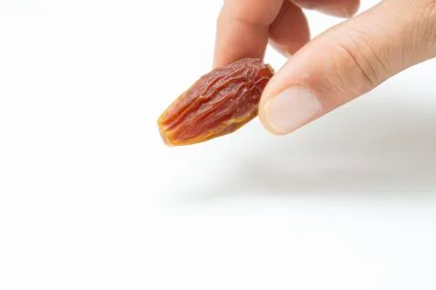 Hand holding  pitted dates Stock Photos