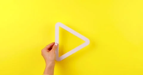 Hand Holding Play Symbol Stock Footage 324955041