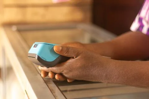 Hand holding pos machine Stock Photos