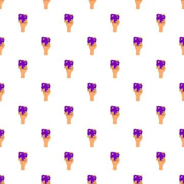 Hand holding present box with purple bow pattern Stock Illustration