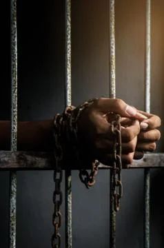  hand holding prison bar Stock Photos