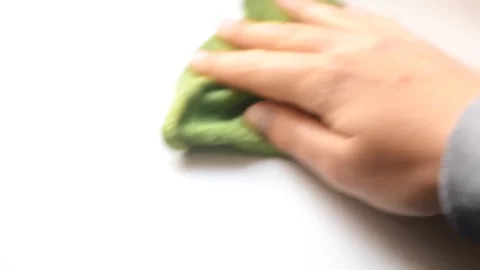 Hand holding a rag isolated on white bac… | Stock Video | Pond5