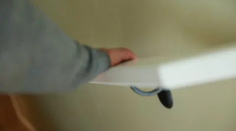 A hand holding onto a railing Stock Footage 32941736