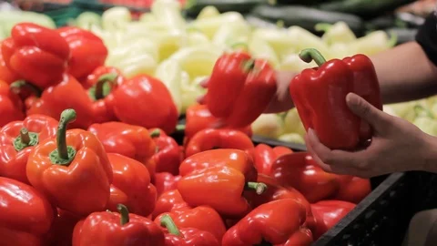 A hand is holding a red bell pepper. Stock Footage 91683448