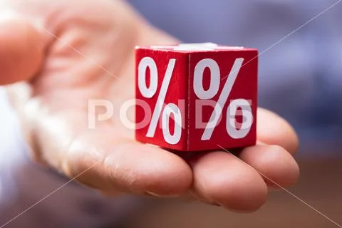 Hand Holding Red Block With Percentage Symbol Stock Photos