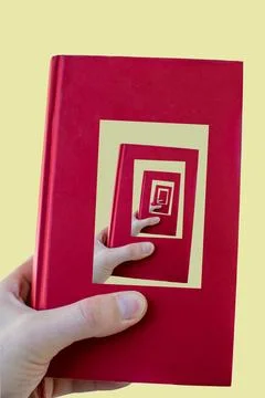 A hand is holding a red book which in it's cover has a photo of the same book. Stock Illustration
