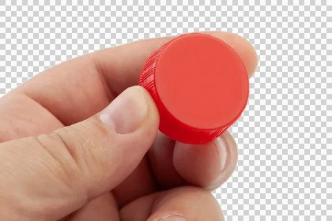 Hand holding red plastic bottle cap Stock Photos