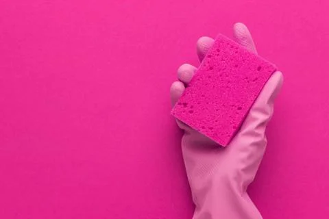 Hand holding red sponge Stock Photos